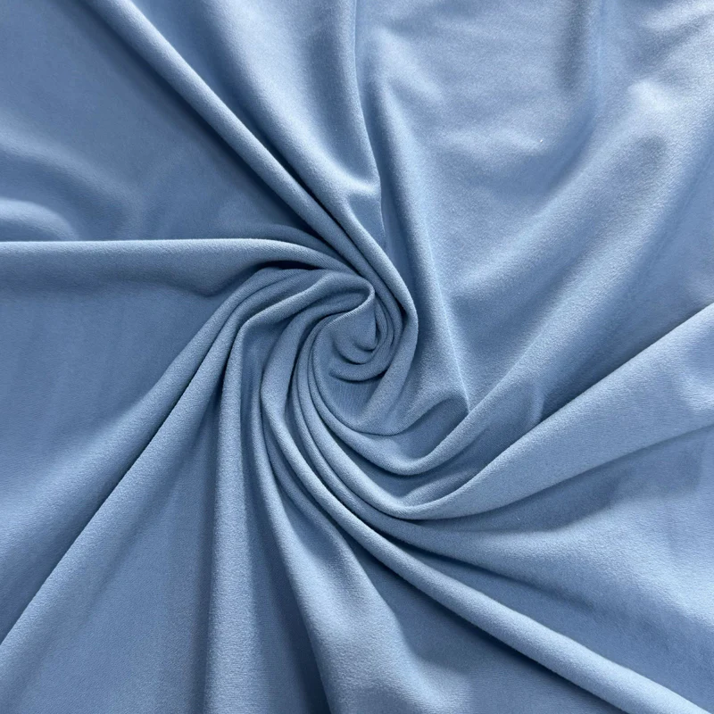 Close-up of nylon-spandex blend fabric for durable and stretchy leggings.